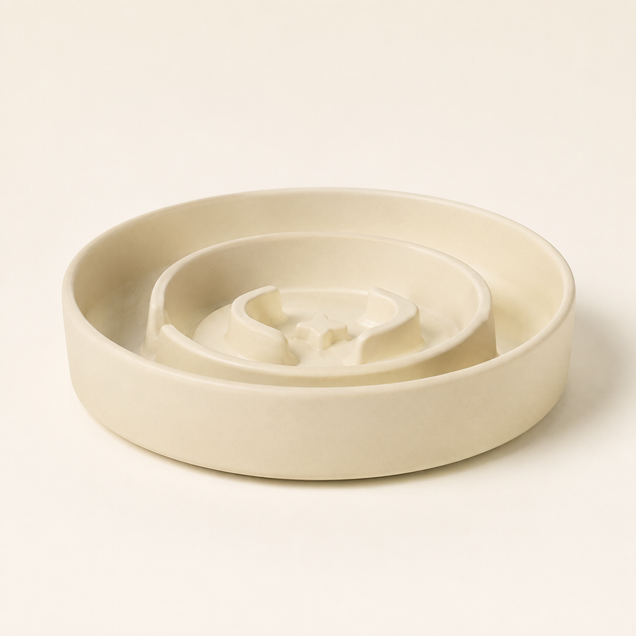 Beige ceramic Bupba Slow Feeder bowl in a studio setting